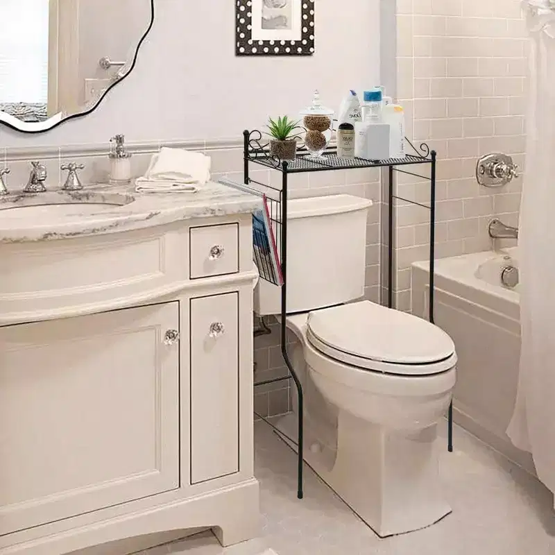 Black Metal Over Toilet Standing Shelf with Vintage Scrollwork Accents and Magazine Basket Freestanding Bathroom