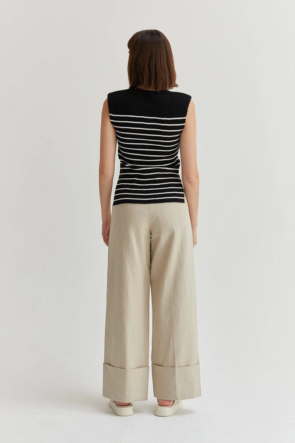 Ribbed Stripe Sleeveless Knit Top with Padded Shoulders and Side Slits