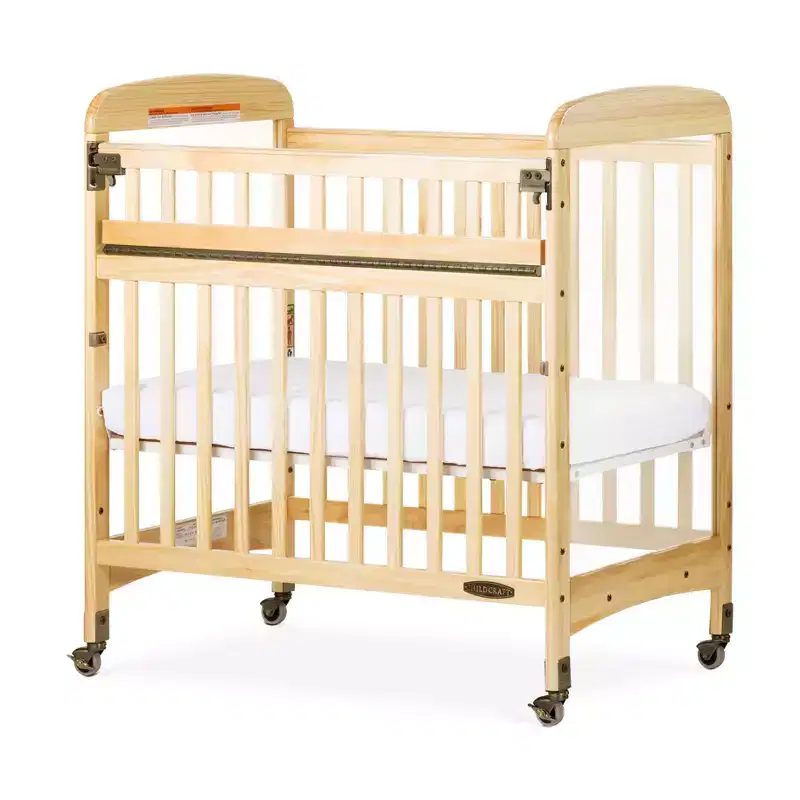 Child Craft Avery SafeAccess Wooden Compact Portable Crib, 2 Easy Roll Locking Wheels, Durable Wood Construction, Fits Through Doorways (Natural)