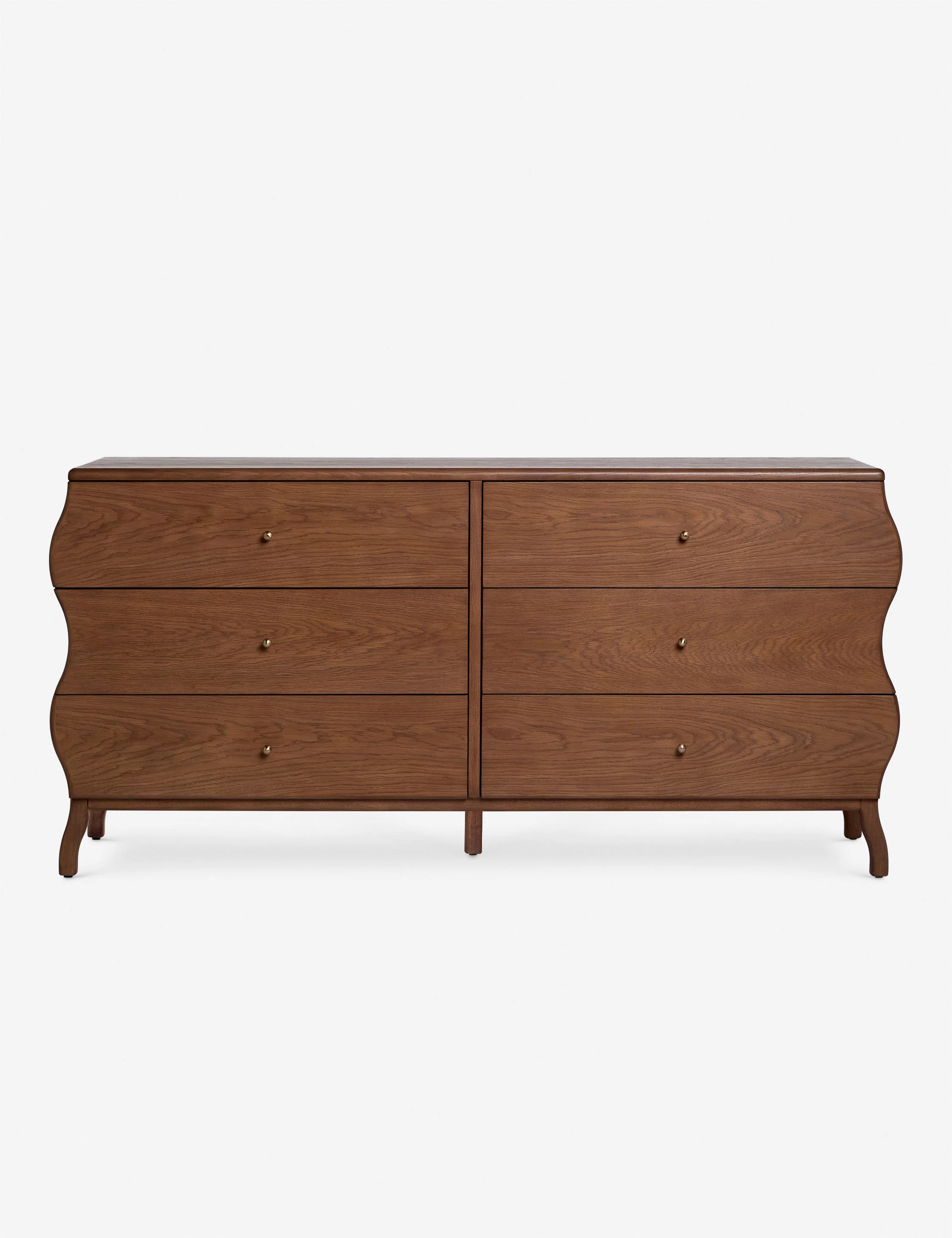 Dresser The dresser brings a whimsical line to spacious bedroom storage. The wavy silhouette strikes a modern feel, with brass ball drawer pulls