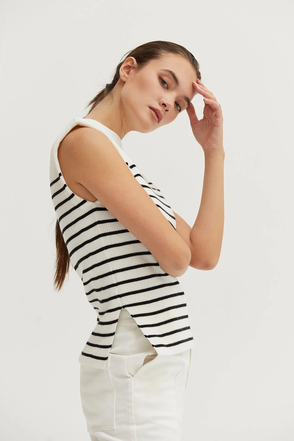 Ribbed Stripe Sleeveless Knit Top with Padded Shoulders and Side Slits