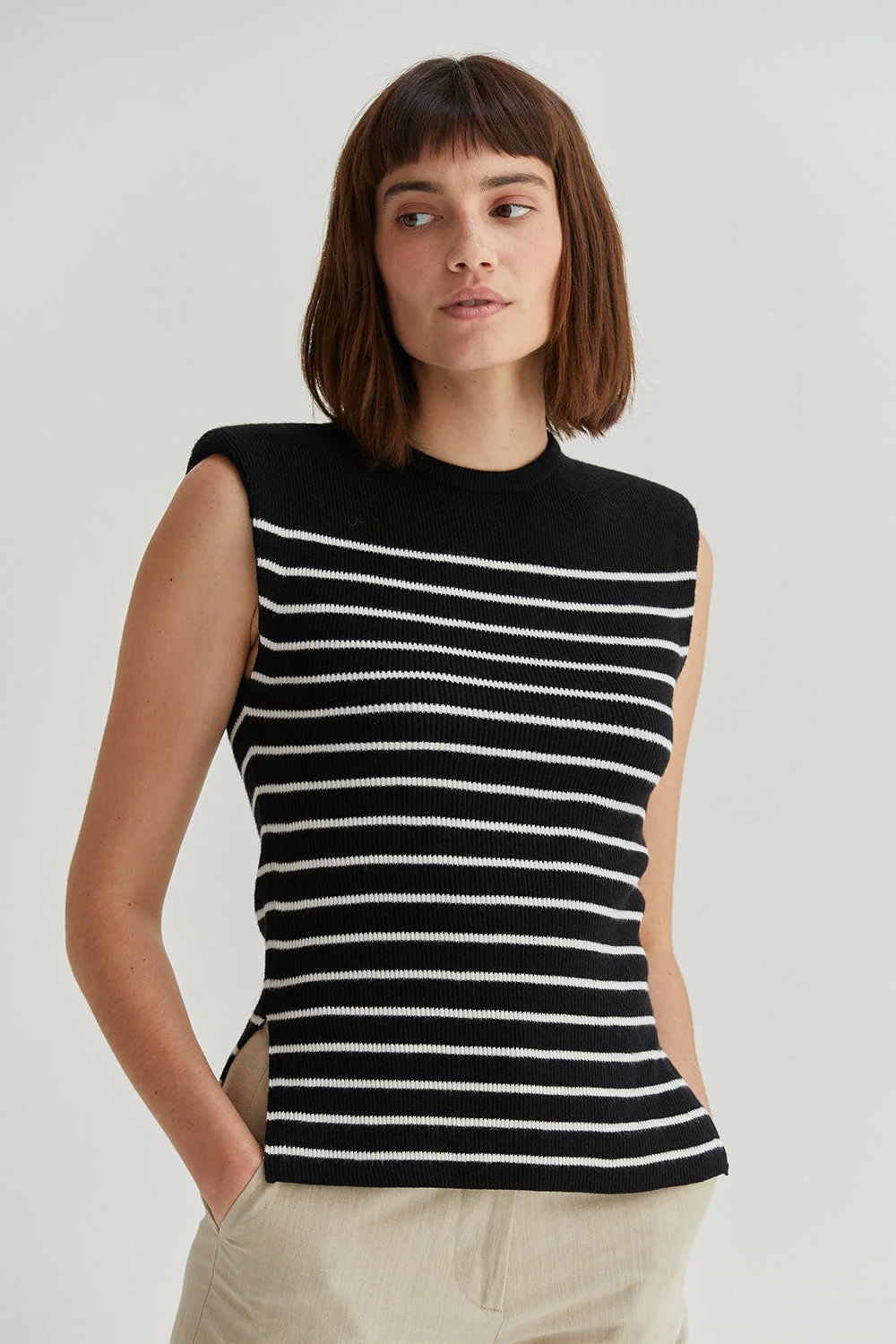 Ribbed Stripe Sleeveless Knit Top with Padded Shoulders and Side Slits