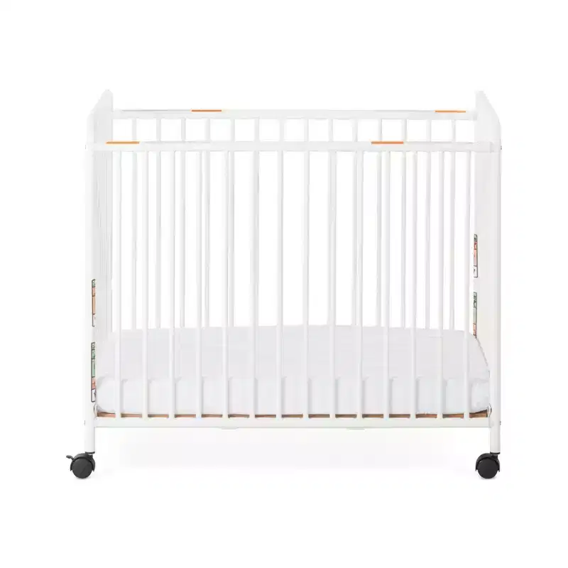 Child Craft Siesta Metal Compact Non-Folding Portable Crib with 2 Crib Mattress and Locking Wheels, Durable Metal Construction, Easy to Clean (White)
