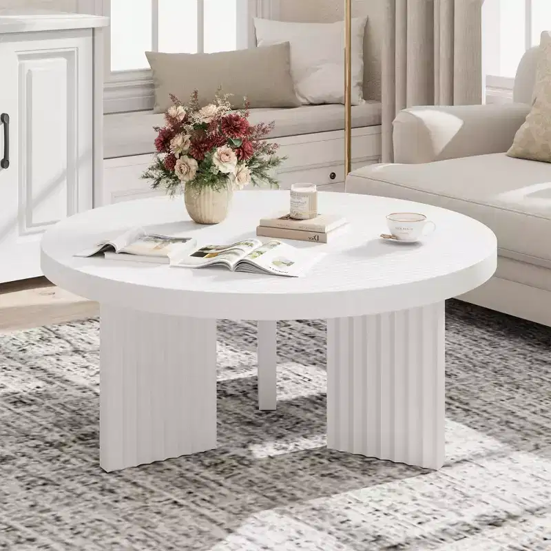 Modern round coffee table  3.3 cm thick top  Elegant fluted legs  Ideal for living room/bedroom  Easy assembly  white wood finish