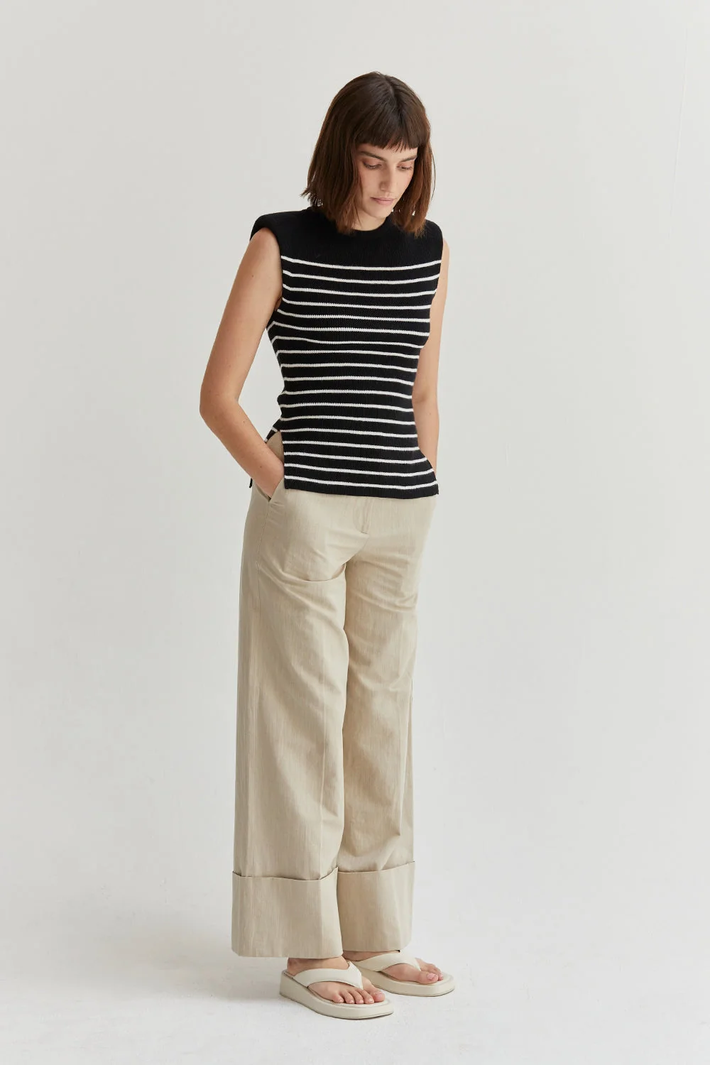 Ribbed Stripe Sleeveless Knit Top with Padded Shoulders and Side Slits
