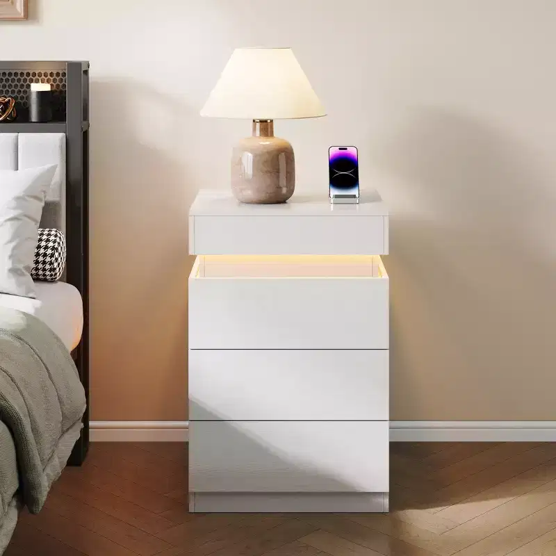 Designed for everyday convenience, this Nightstand with Built-In Charging Station and LED Lighting, 3-Drawer Sliding-Top Modern Bedside Table,.