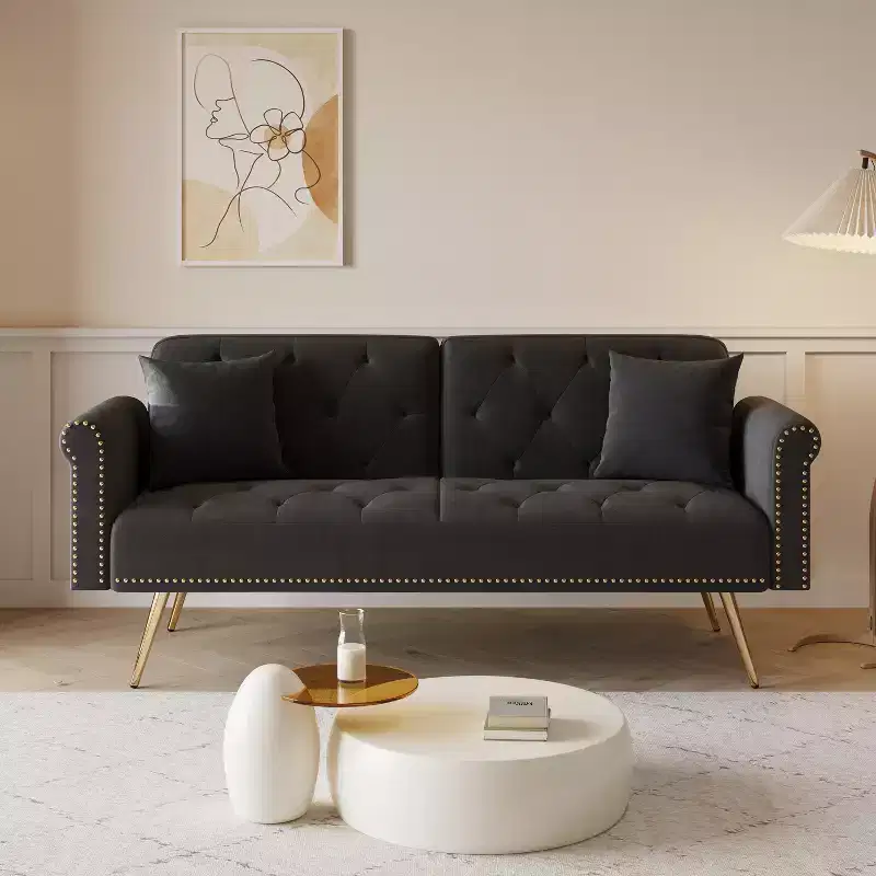 Black Velvet Fabric Sofa Featuring Nail Head Trim and Accompanied By A Matching Throw Pillow