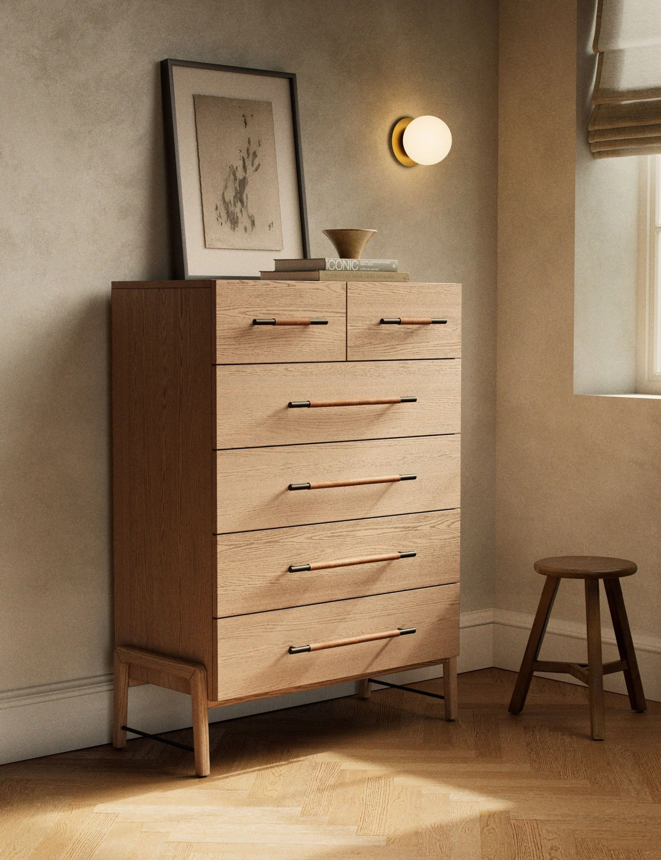 Dresser With its clean lines, sandy finish, and leather accents, this tall dresser brings a refined, minimalist effect to your bedroom. Constructed