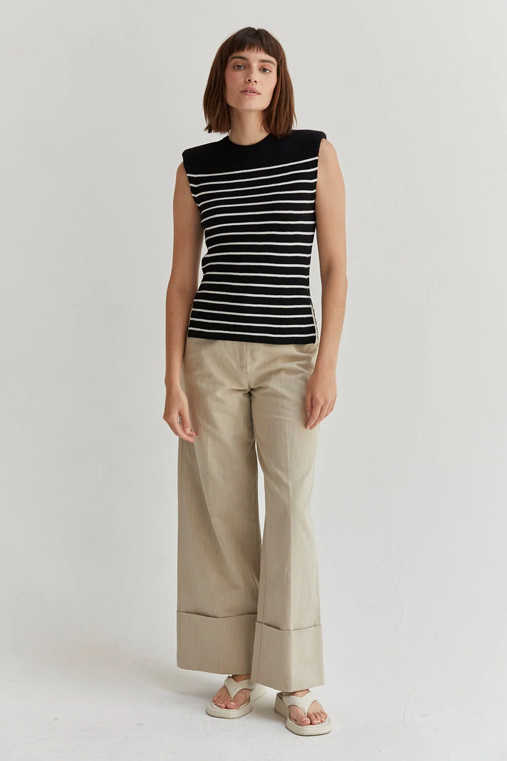 Ribbed Stripe Sleeveless Knit Top with Padded Shoulders and Side Slits