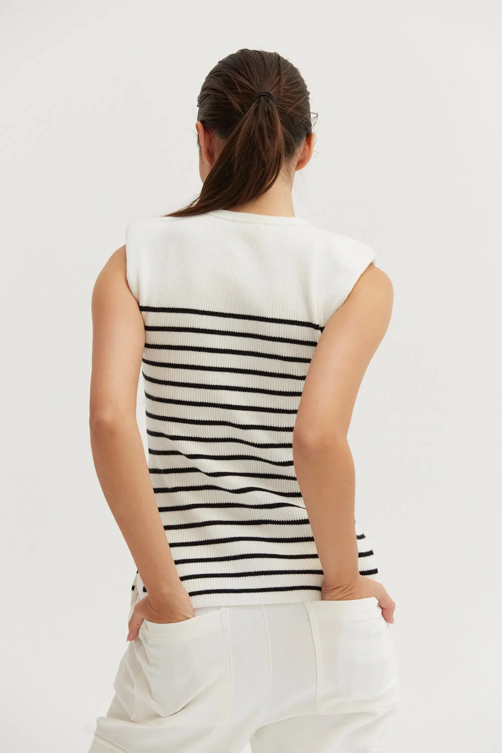 Ribbed Stripe Sleeveless Knit Top with Padded Shoulders and Side Slits