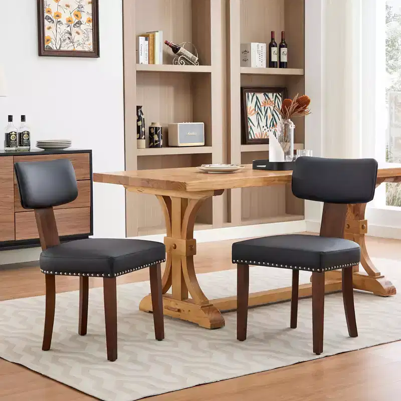 Two dining chairs in a set, modern leather upholstered, wood frame, 265 lb load capacity, easy to clean, curved backrest.
