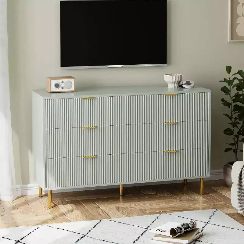 Six-drawer chest of drawers, modern wooden storage unit with gold-tone metal handles and anti-tipping mechanism, suitable for bedrooms, living rooms.