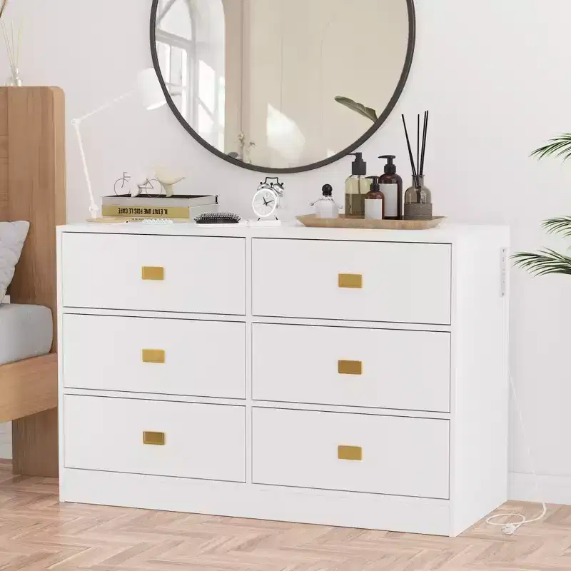 White six-drawer nursery dressing table/changing table - removable tabletop with changing mat, includes storage space for clothes and accessories.