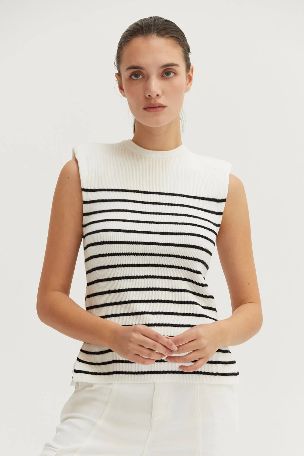 Ribbed Stripe Sleeveless Knit Top with Padded Shoulders and Side Slits